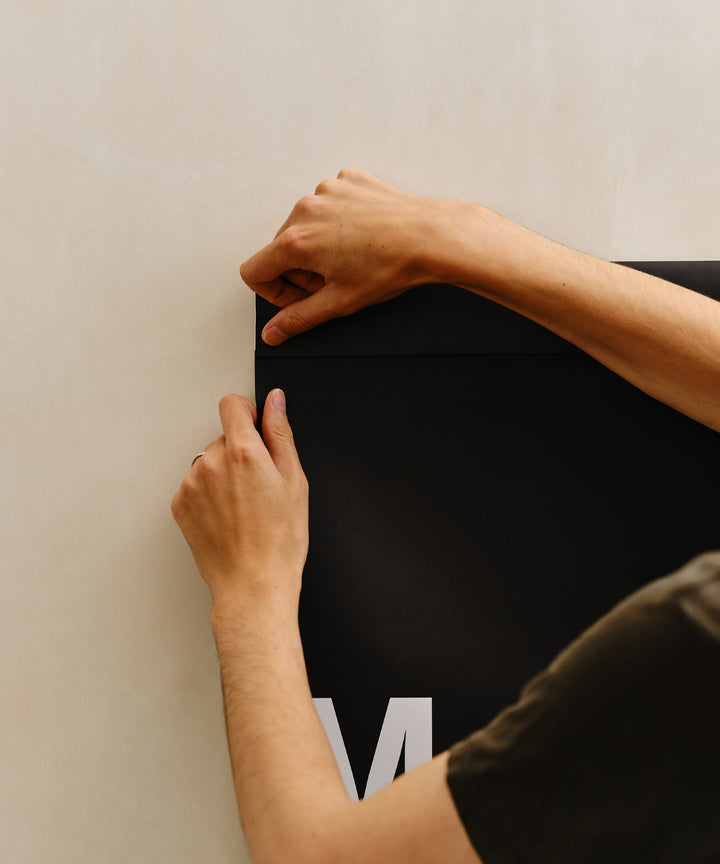 Find the perforation hidden beneath the header, about 1cm / 0.5" from the bottom.